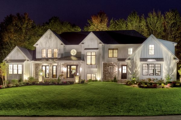home illuminated by outdoor lighting