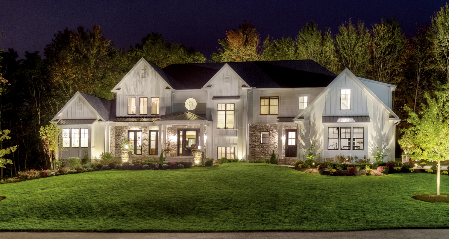 home illuminated by outdoor lighting