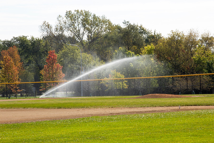 commercial sprinklers on baseball field