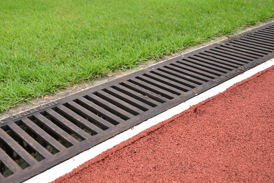 drain system on side of running track